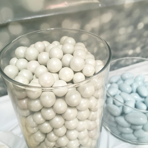 Jordan almonds and Sixlets are must-have candies for a candy bar! candy in a vase