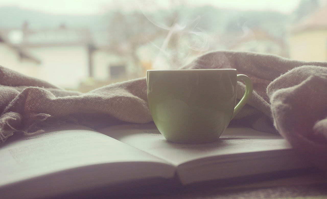 Coffee sitting on a book