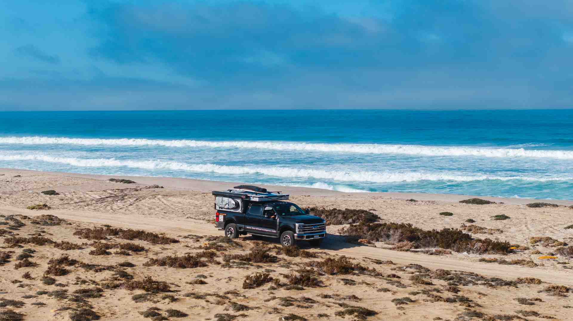 a truck camper parked at a scenic Highway 1 overlook near Bixby Bridge - Highway 1 California