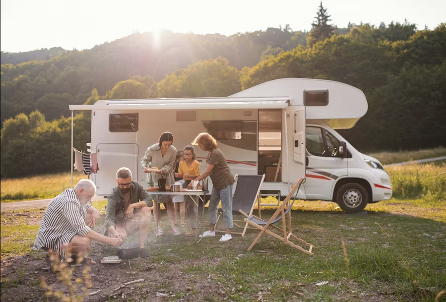 Family picnic next to RV
