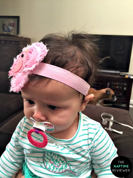 baby with a bird hair bow