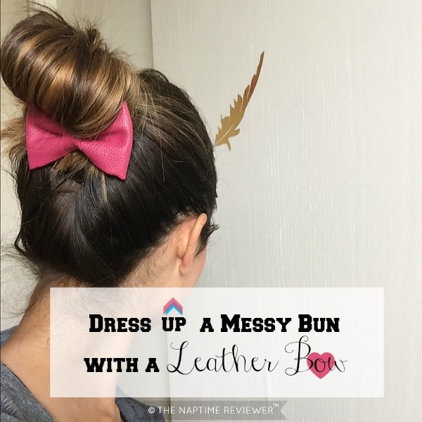 messy bun with a leather bow
