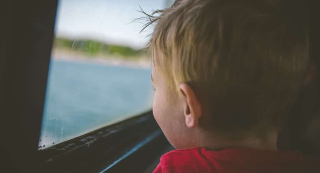 road trip - child viewing the lake