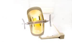 A dentist light or lamp against the ceiling of the room
