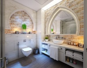 Unique Master Bathroom with Arches Mirrors and Bricks