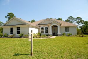 White and Brown Concrete House Under Clear Blue Sky