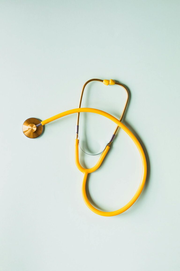 Medical stethoscope placed on white background